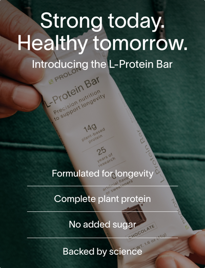 L-Protein Bar packaging held by a hand with promotional text on a dark background