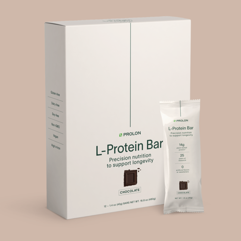Box and single protein bar on pink background 